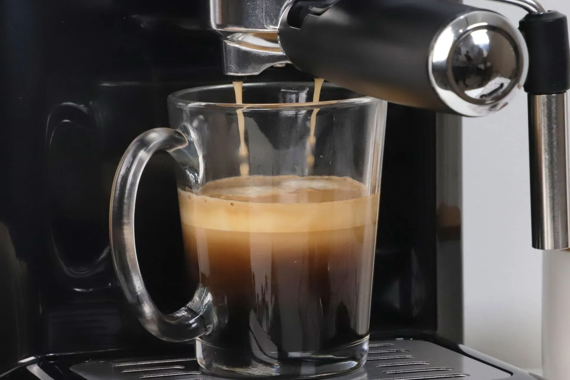 A freshly pulled espresso shot with golden crema from a light roast single-origin coffee