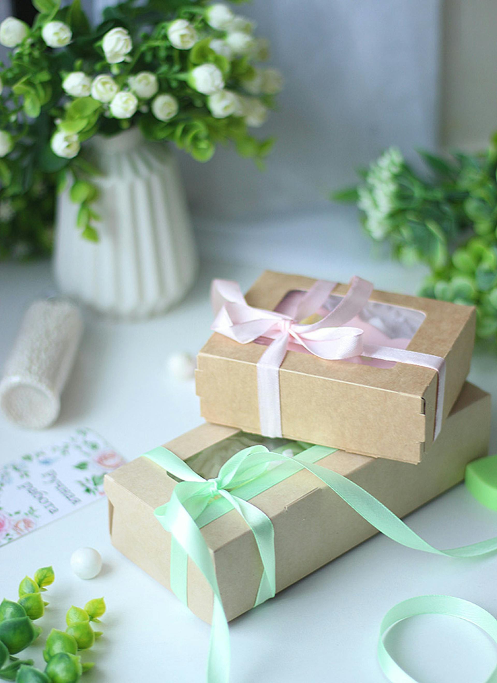 Kraft gift boxes with ribbons and warm floral decor — specialty coffee gift ideas from The Roaring Bean Tennessee