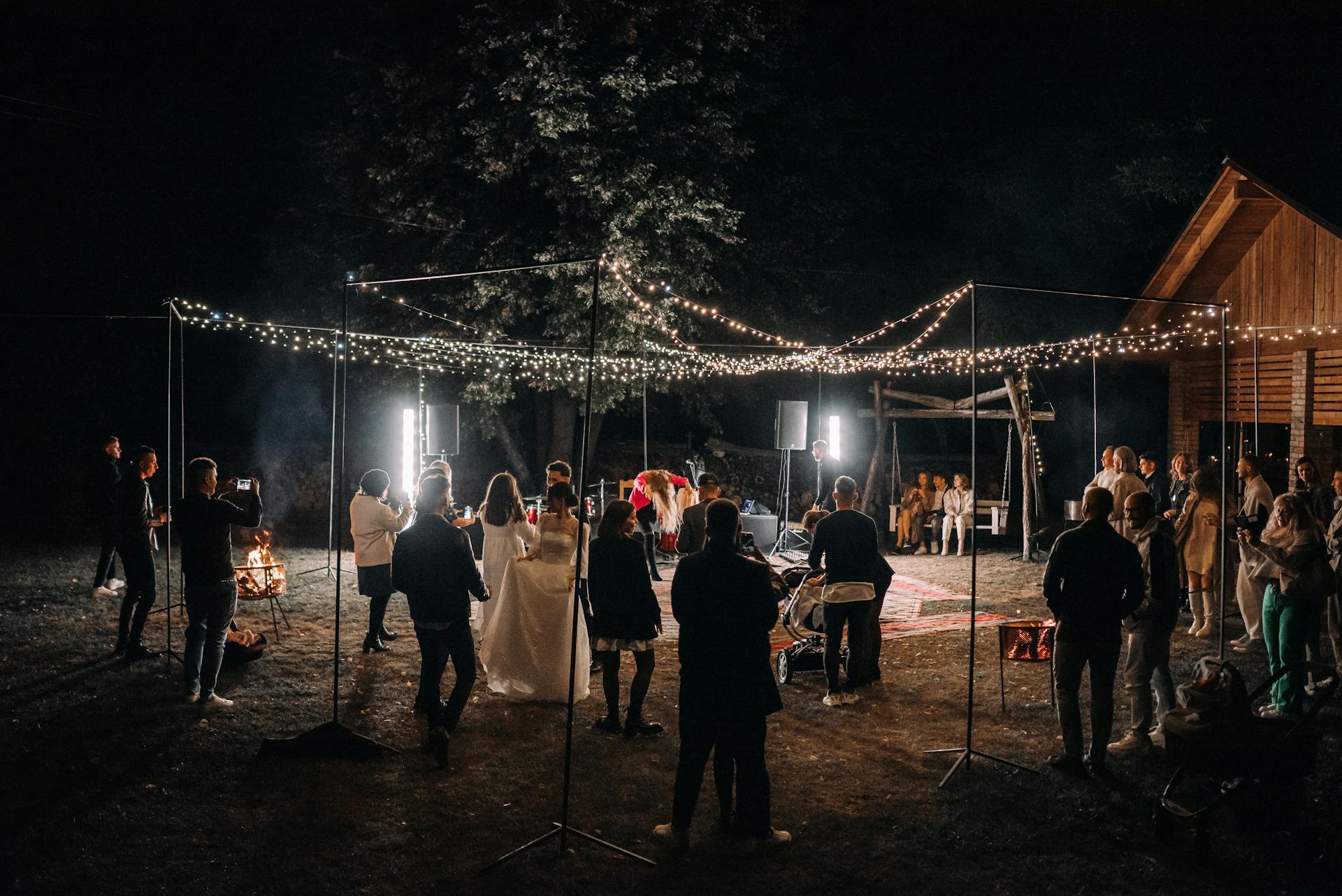 Outdoor wedding reception at night with string lights at a Clarksville Tennessee venue