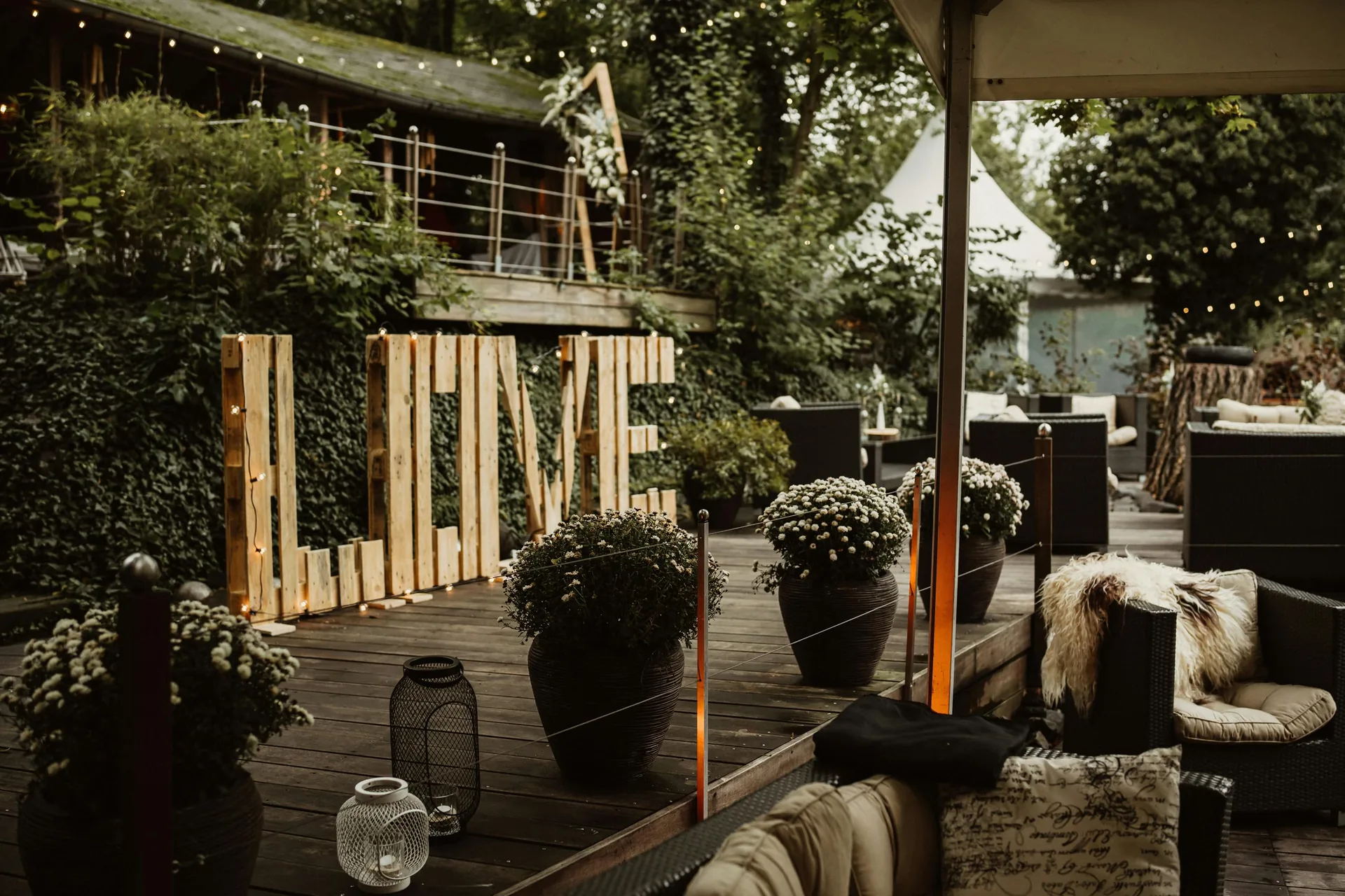 Romantic outdoor wedding venue with glowing LOVE sign — Nashville event space
