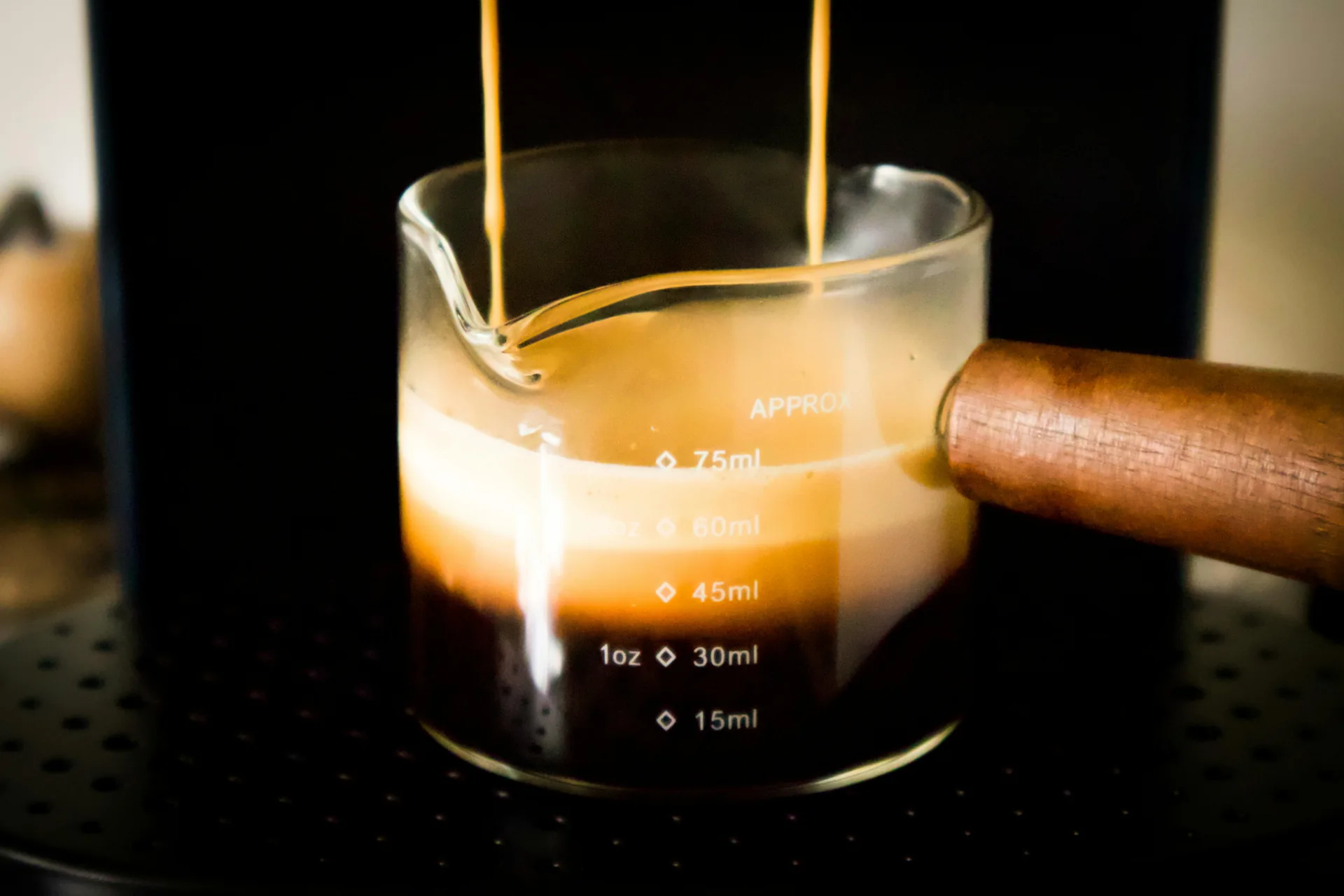 Professional barista crafting espresso drinks at a wedding event — The Roaring Bean coffee catering